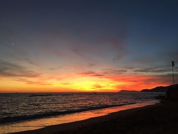 Scenic view of sea at sunset