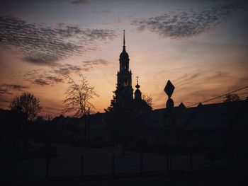 Silhouette of building against sky during sunset