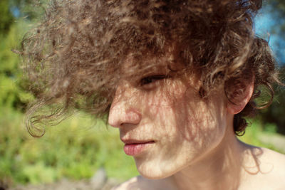 Close-up of young woman looking away