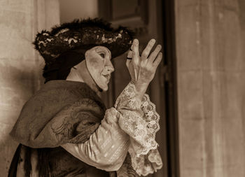 Side view of man in costume during venice carnival
