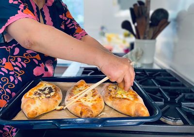 Midsection of person preparing food