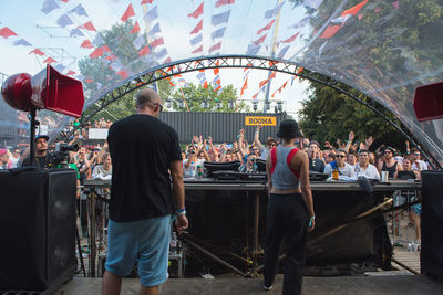 Rear view of people at amusement park