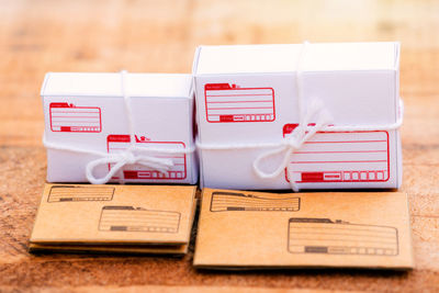 Close-up of boxed and paper mail delivery concept