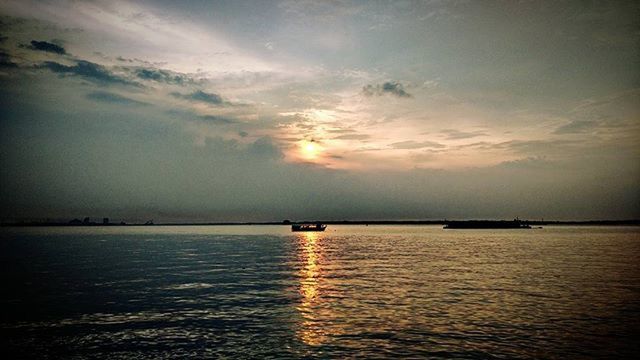 water, sunset, sea, sky, tranquil scene, tranquility, scenics, beauty in nature, waterfront, horizon over water, cloud - sky, nature, nautical vessel, sun, idyllic, reflection, transportation, boat, cloud, silhouette