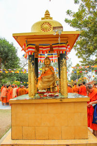 Statue of temple against building