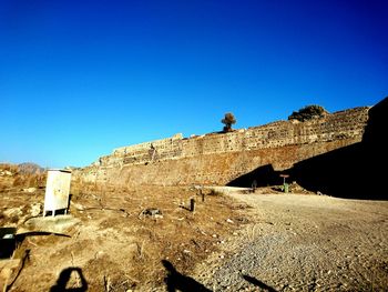 View of fort against blue sky