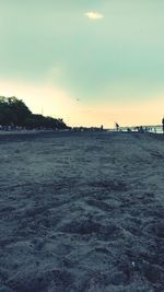 Scenic view of beach against sky during sunset