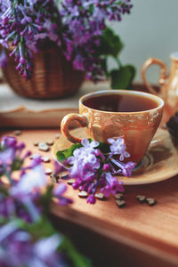 Close-up of purple roses on table