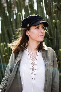 Portrait of young woman standing outdoors