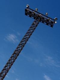 Low angle view of crane against sky