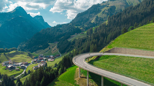 High angle view of road amidst mountains against sky