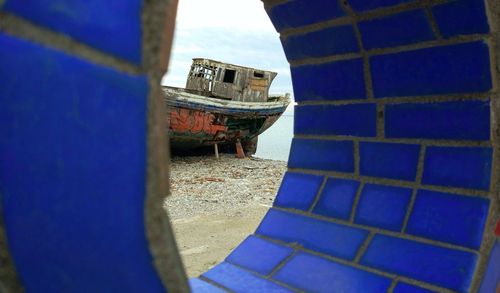 Rusty boat in blue sea