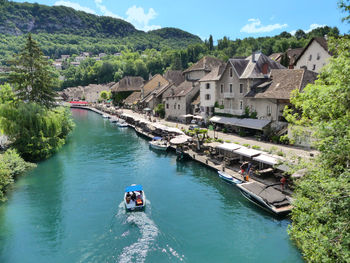 High angle view of river amidst buildings and mountains