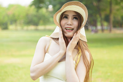 Young woman standing at park