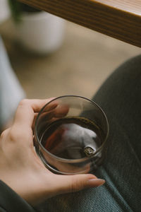 Midsection of woman holding drink