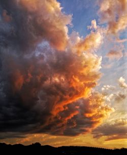 Low angle view of dramatic sky during sunset