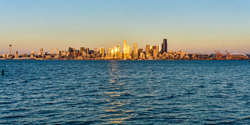 Sunlight reflects from buildings of the seattle skyline in washington state.
