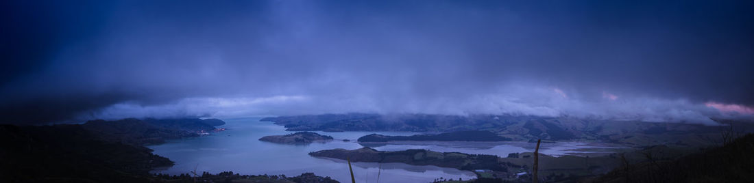 Panoramic view of mountains against sky at dusk