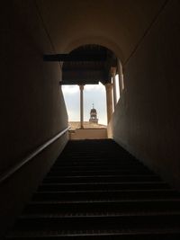 Low angle view of silhouette people on staircase in building