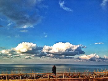 Scenic view of sea against cloudy sky