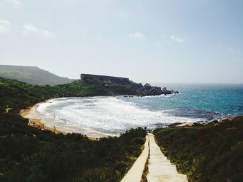 Empty road leading towards sea