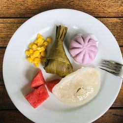 High angle view of fruits in plate on table