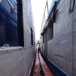 Alley amidst buildings in city