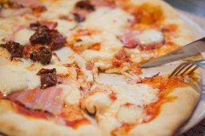 Close-up of pizza in plate on table