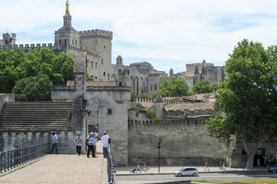 Group of people in front of historical building