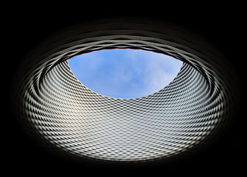 Eye to the sky architecture pattern with look through effect in blue sky