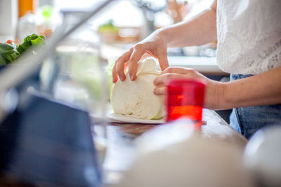 Midsection of woman preparing food