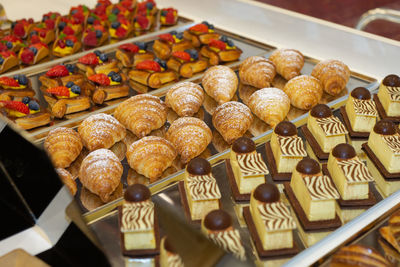 Fruit pastries with strawberries and black cherries.