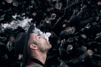 Portrait of man smoking cigarette