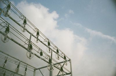 Low angle view of electricity pylon against sky