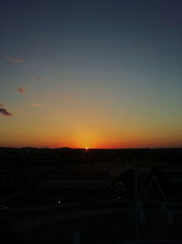 Silhouette landscape against clear sky during sunset