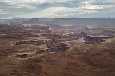 Aerial view of landscape against cloudy sky