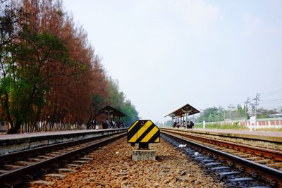 Railway tracks against clear sky