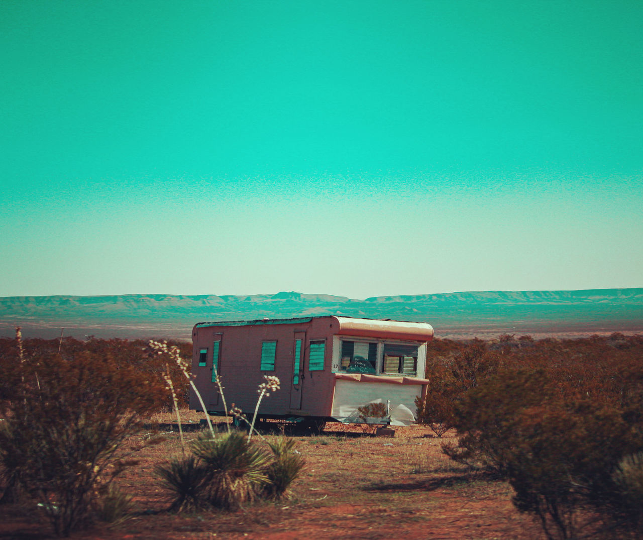 BUILT STRUCTURE ON SHORE AGAINST CLEAR SKY