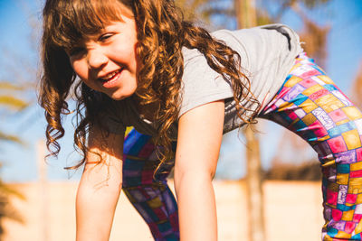 Portrait of cheerful girl outdoors