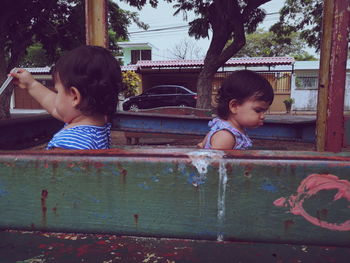 Girl and woman wearing sunglasses against water