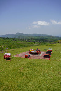 Scenic view of agricultural field against sky