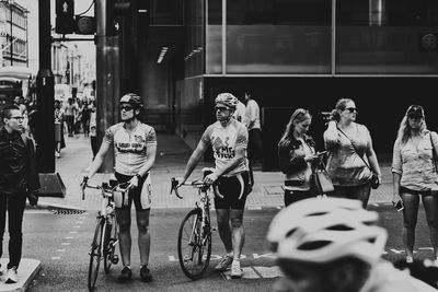 People on bicycle in city