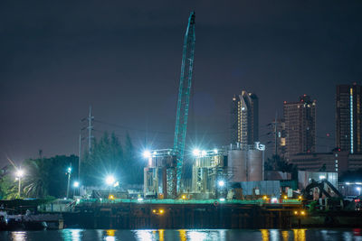 Illuminated buildings in city at night