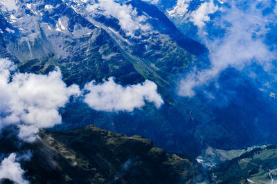 Aerial view of mountain range against sky