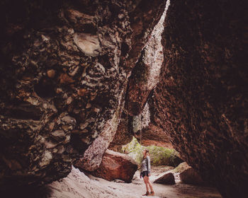 High angle view of man standing on rock