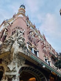 Low angle view of statue of building against sky