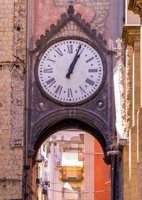 Low angle view of clock on old building