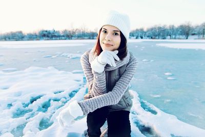 Portrait of beautiful young woman in snow