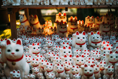 Close-up of figurines for sale at market stall