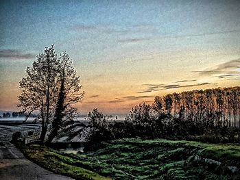 Scenic view of landscape against sky during sunset